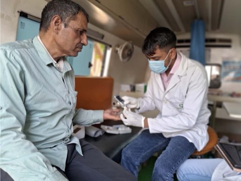 A random blood sugar test being run on a glucometer during a clinic session in the van.